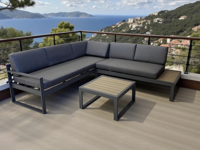 Salon de jardin d'angle en aluminium anthracite avec coussins gris, idéal pour profiter du soleil avec vue panoramique sur la mer et la nature.